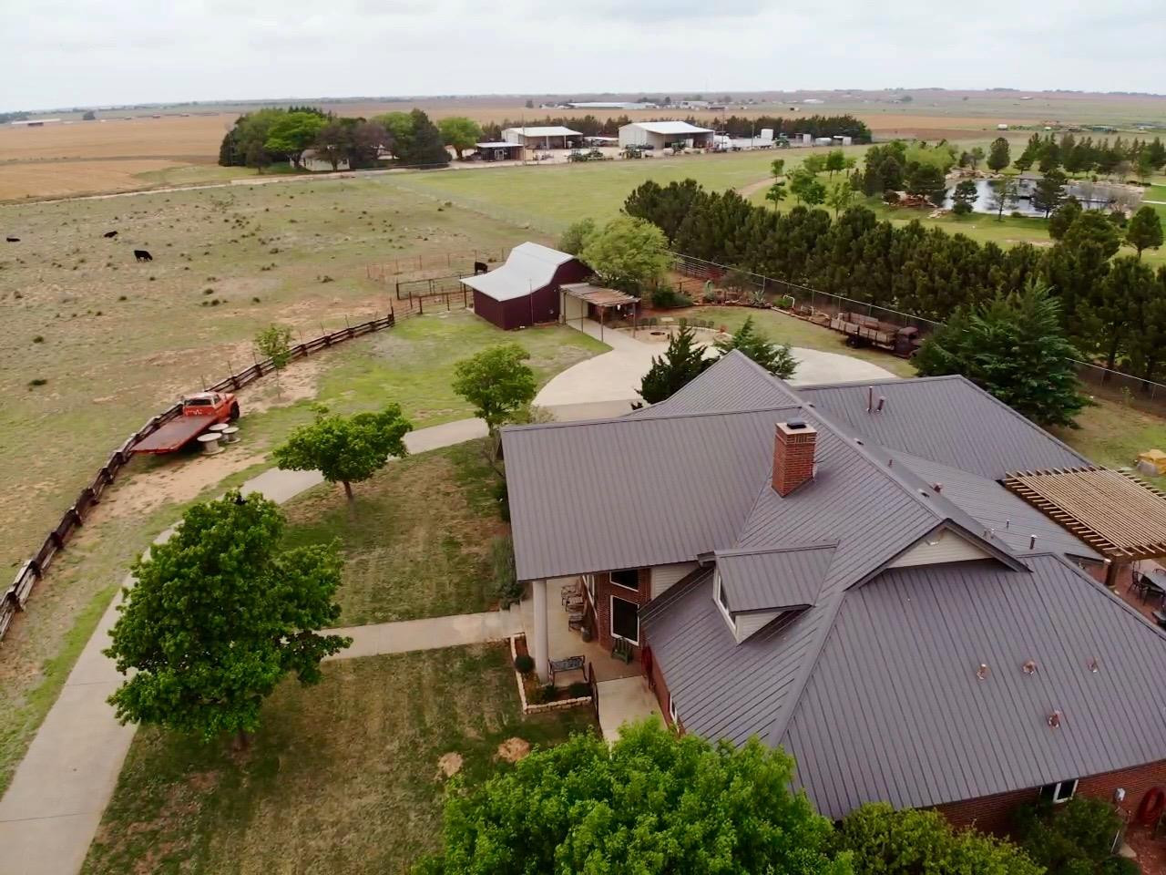 9002 Woodrow Road Wolfforth, TX 79382 - Photo 48 of 48 an aerial view of a house with garden space and outdoor seating