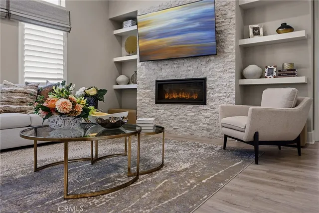 a living room with furniture and a fireplace