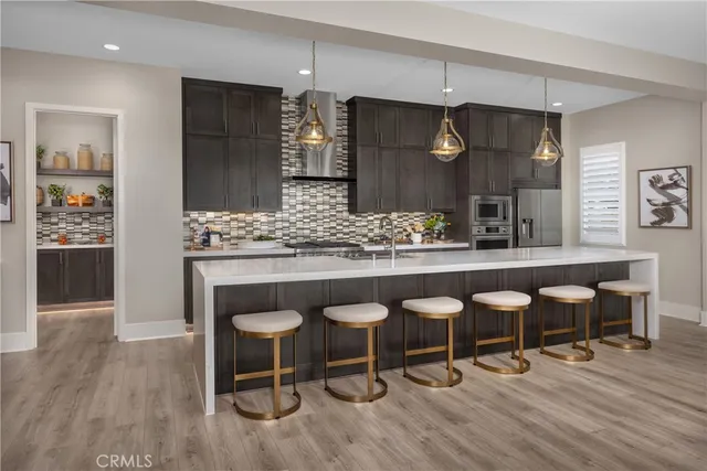 a kitchen with a table and chairs in it