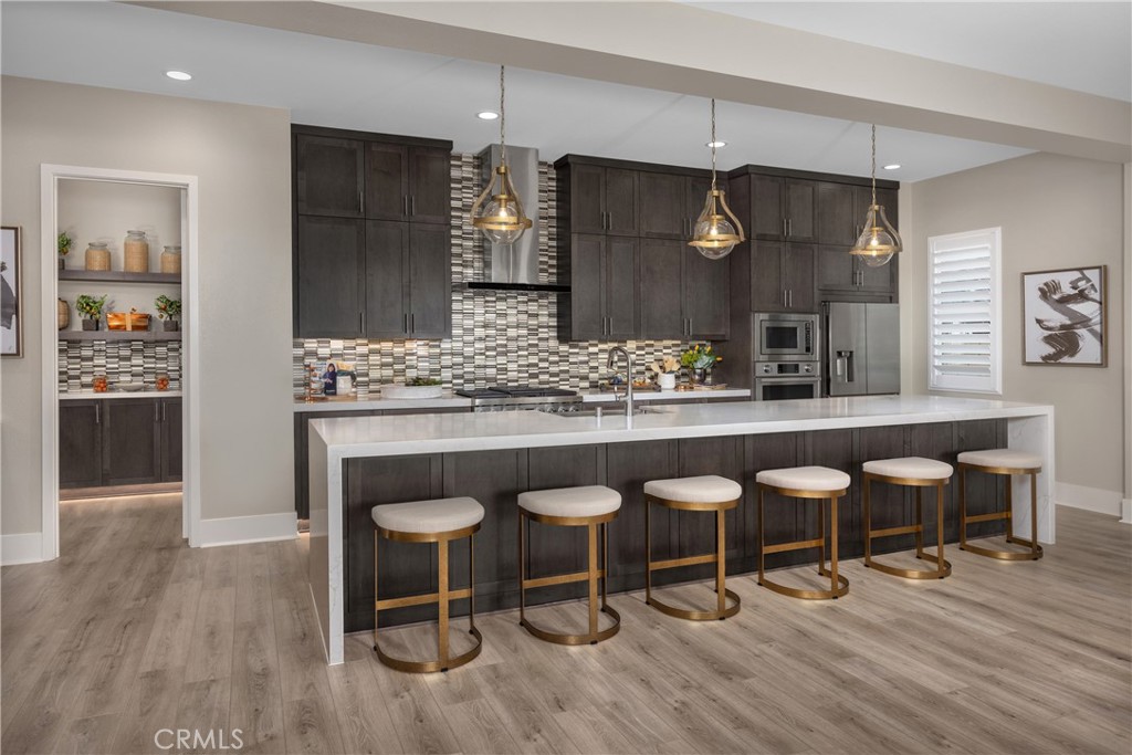 6505 Canyon Oaks Drive Simi Valley, CA 93063 - Photo 6 of 21 a kitchen with a table and chairs in it