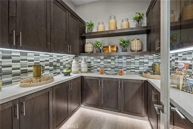 a kitchen with stainless steel appliances granite countertop a sink and a stove
