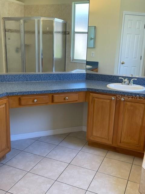740 Pickfair Terrace Lake Mary, FL 32746 - Photo 16 of 26 a bathroom with a sink and a mirror