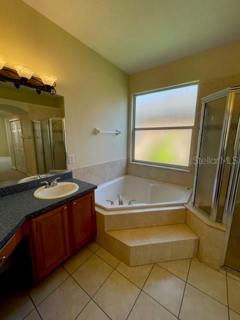 740 Pickfair Terrace Lake Mary, FL 32746 - Photo 17 of 26 a bathroom with a tub sink and mirror