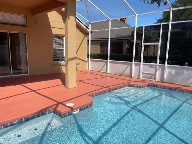 740 Pickfair Terrace Lake Mary, FL 32746 - Photo 25 of 26 a swimming pool with the view of house in the background