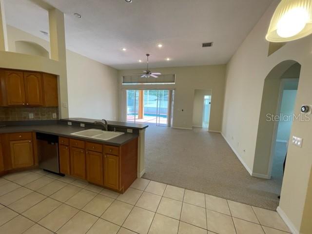 740 Pickfair Terrace Lake Mary, FL 32746 - Photo 8 of 26 a kitchen with granite countertop a sink and a stove