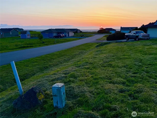 a view of a table and chairs in the garden