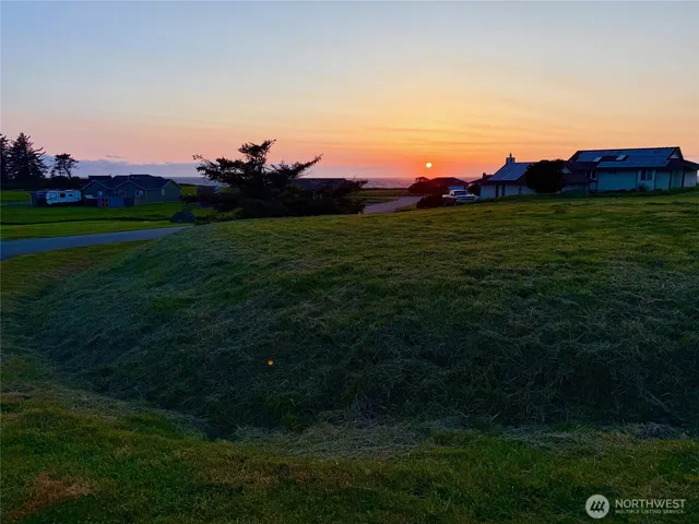 a view of grassy field and yard