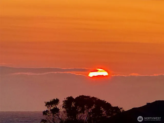a view of ocean with sunset