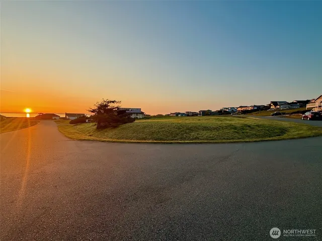 a view of a large mountain with mountains in the background