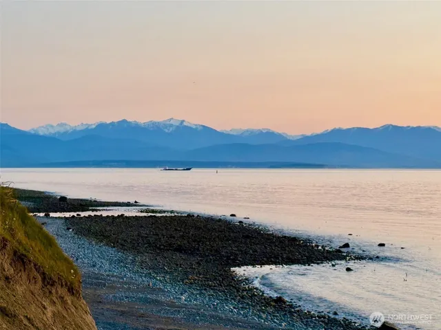 a sign board with a lake view