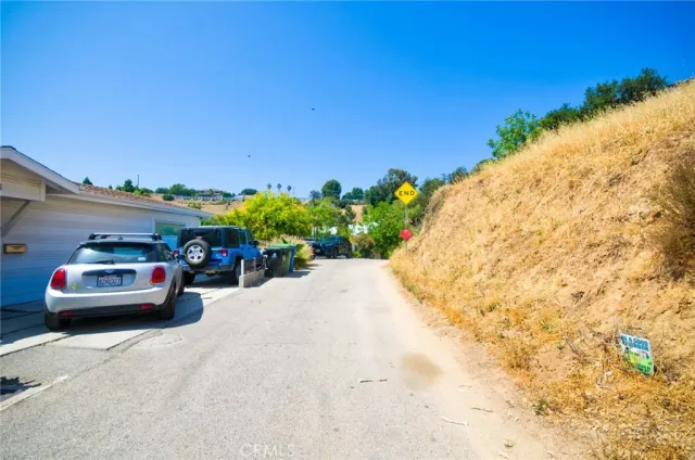 an aerial view of a house with a yard and lake view