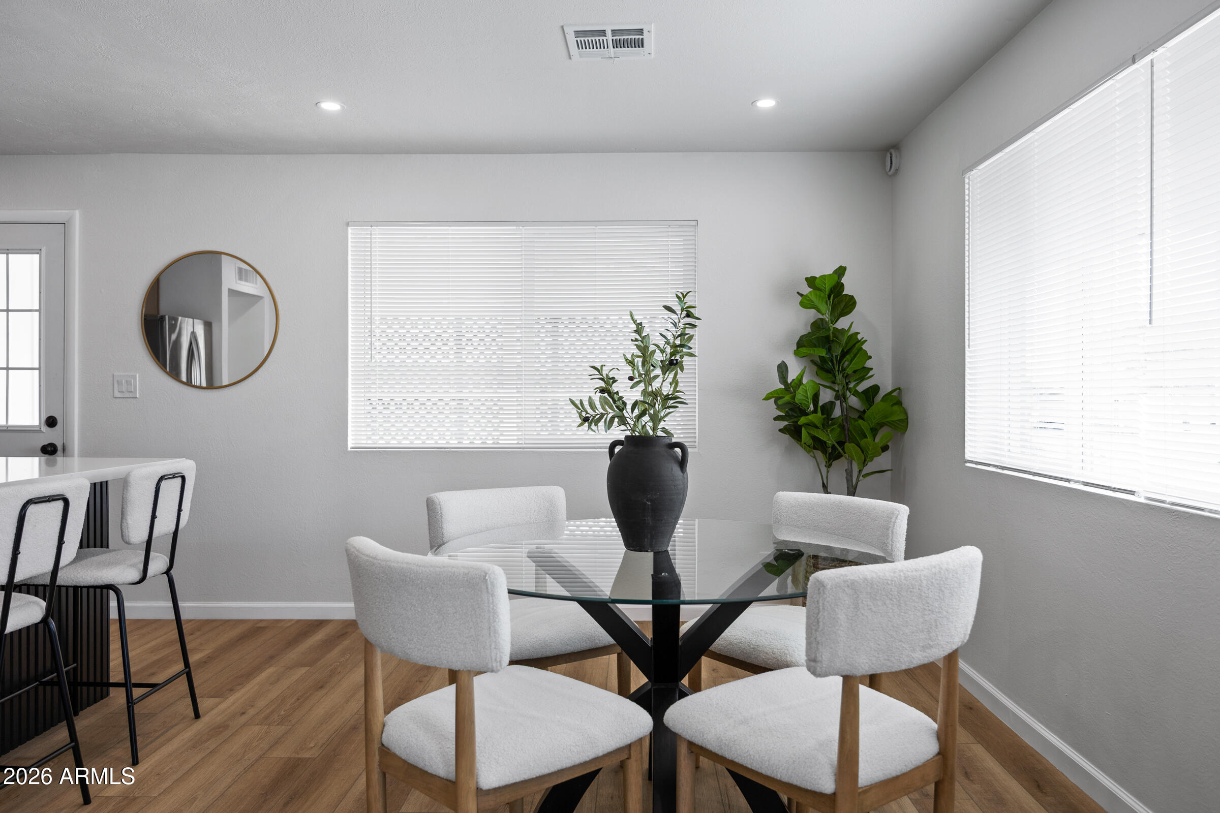 1237 East Ruth Avenue Phoenix, AZ 85020 - Photo 17 of 38 a view of a dining room with furniture and wooden floor