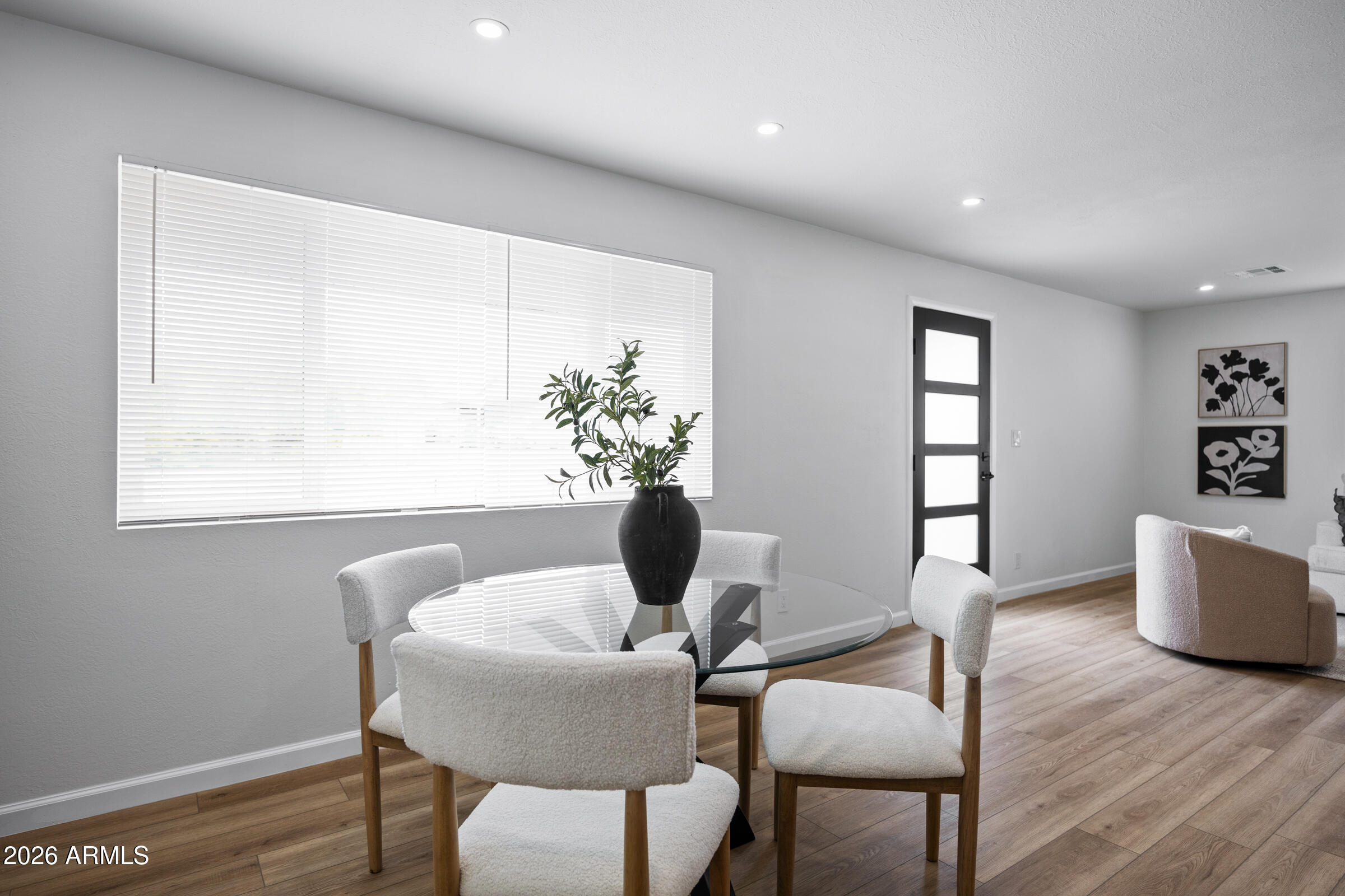 1237 East Ruth Avenue Phoenix, AZ 85020 - Photo 18 of 38 a view of a dining room with furniture and wooden floor