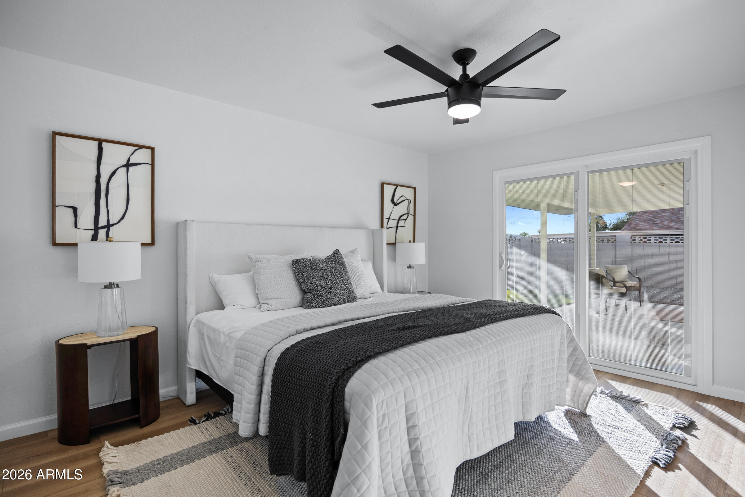 1237 East Ruth Avenue Phoenix, AZ 85020 - Photo 26 of 38 a bed room with a bed and a ceiling fan
