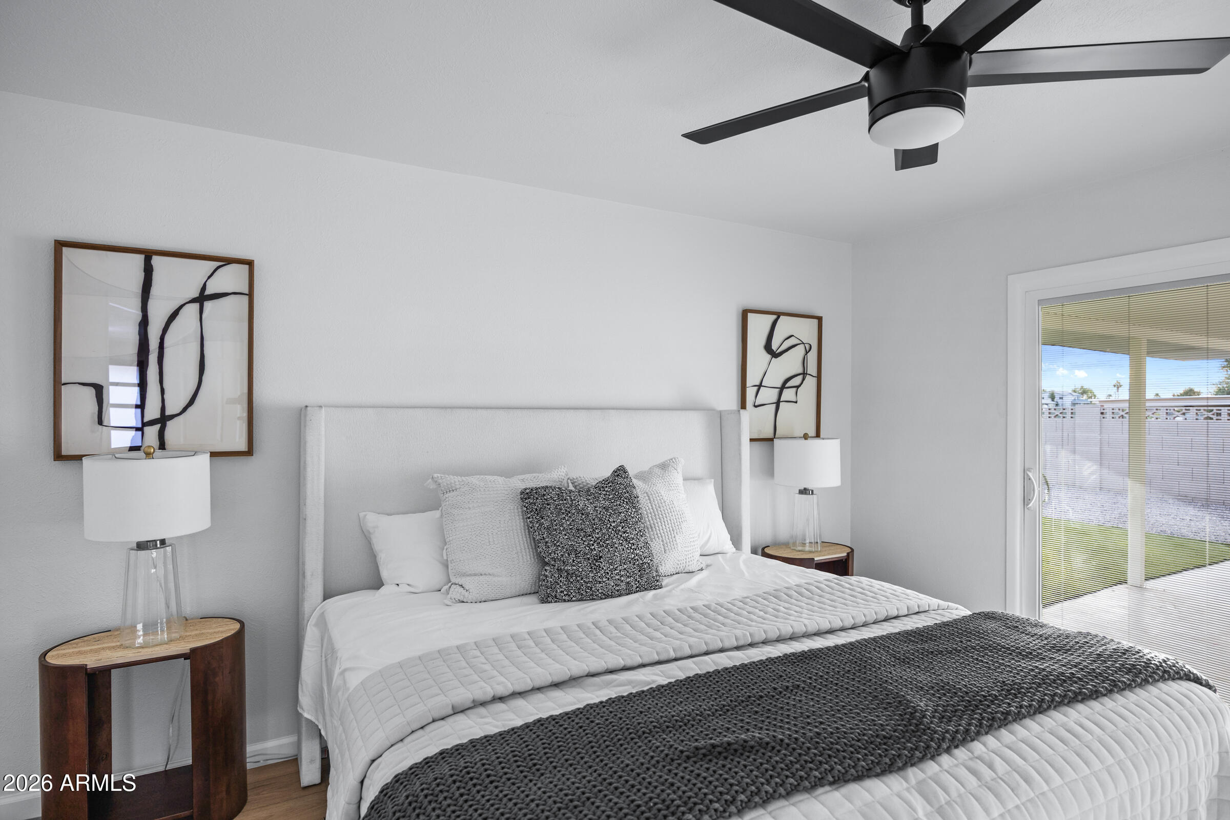 1237 East Ruth Avenue Phoenix, AZ 85020 - Photo 30 of 38 a bedroom with a bed and a lamp on table