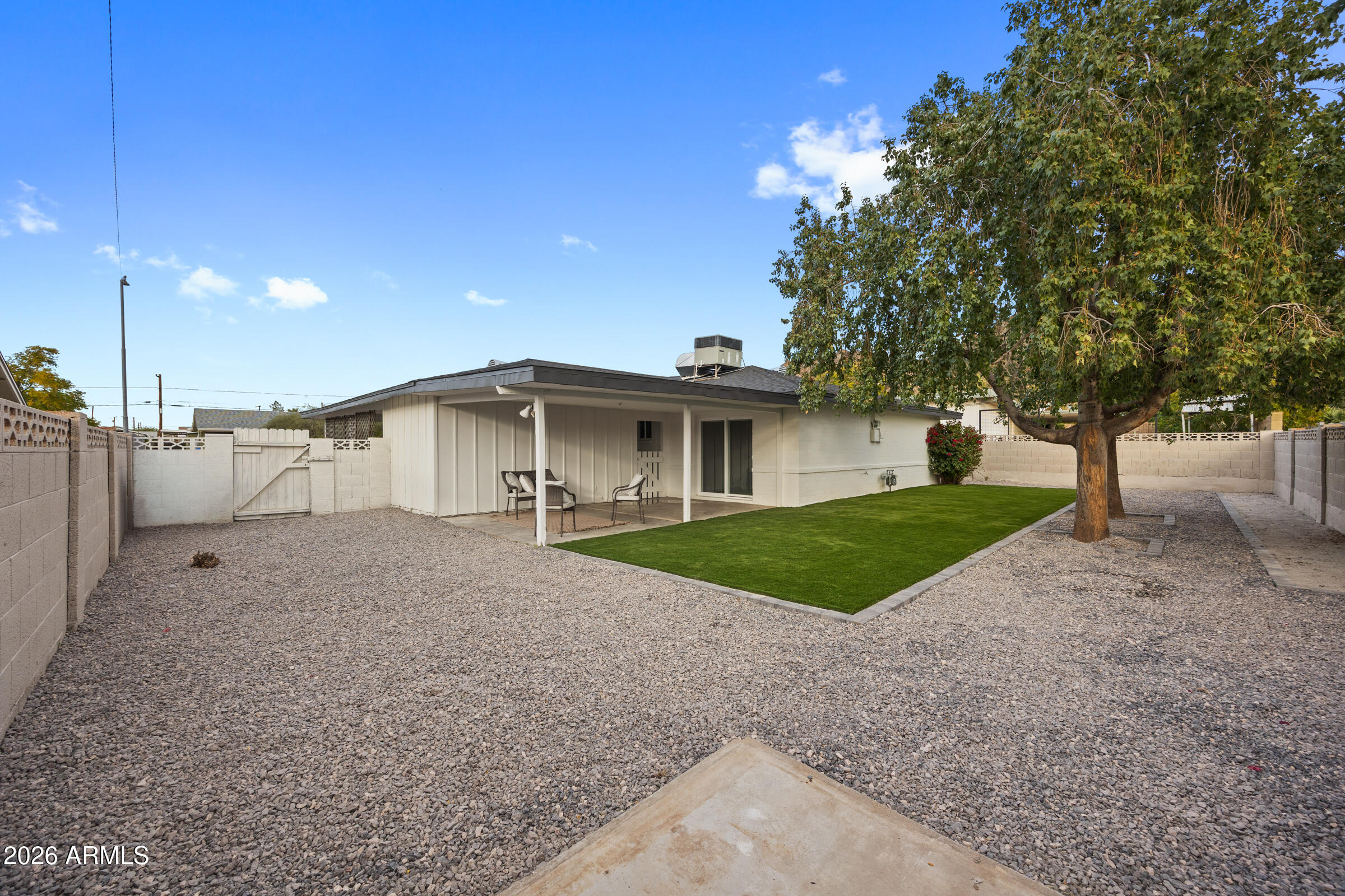 1237 East Ruth Avenue Phoenix, AZ 85020 - Photo 32 of 38 a view of a house with a yard and large tree