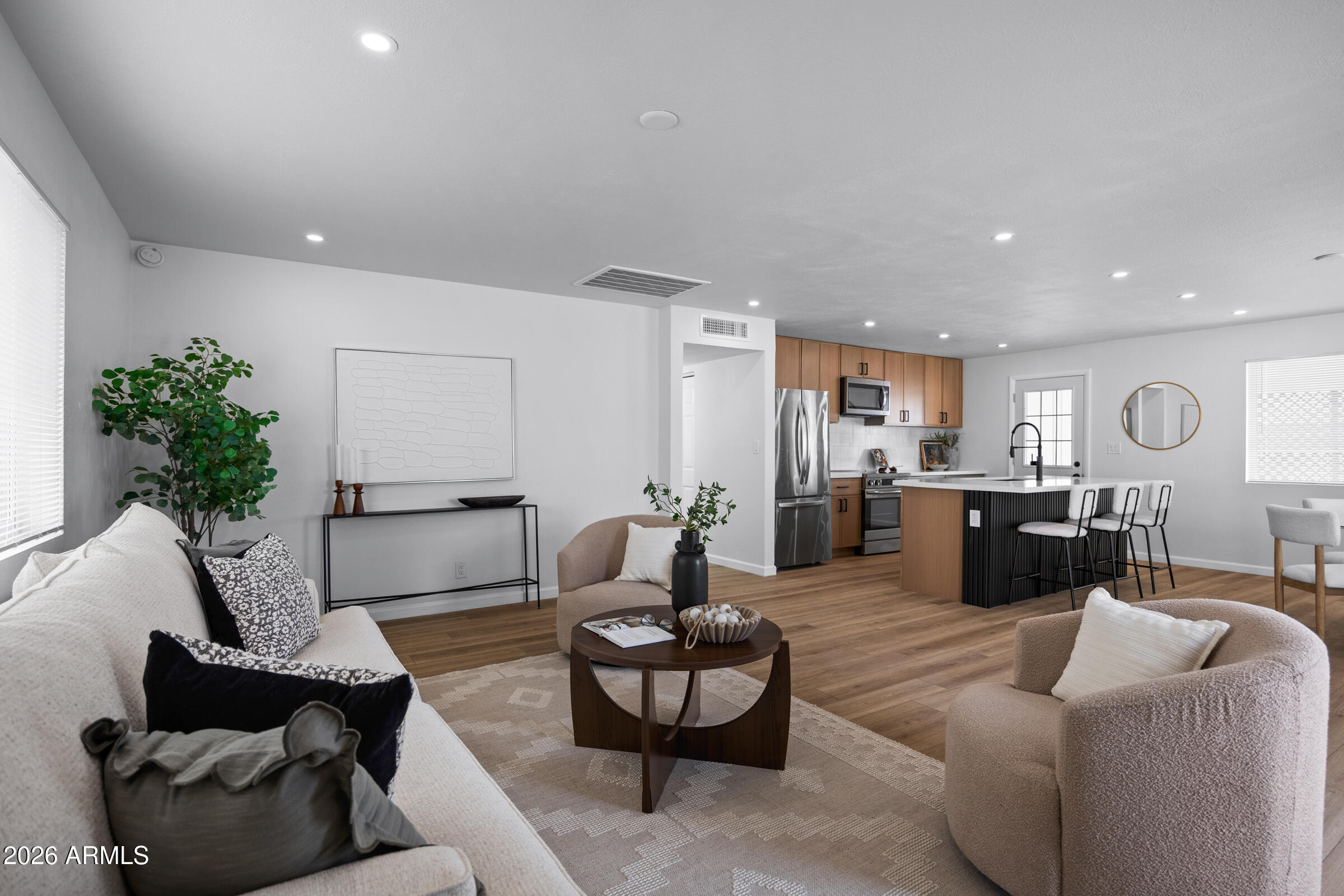 1237 East Ruth Avenue Phoenix, AZ 85020 - Photo 7 of 38 a living room with furniture kitchen and a potted plant