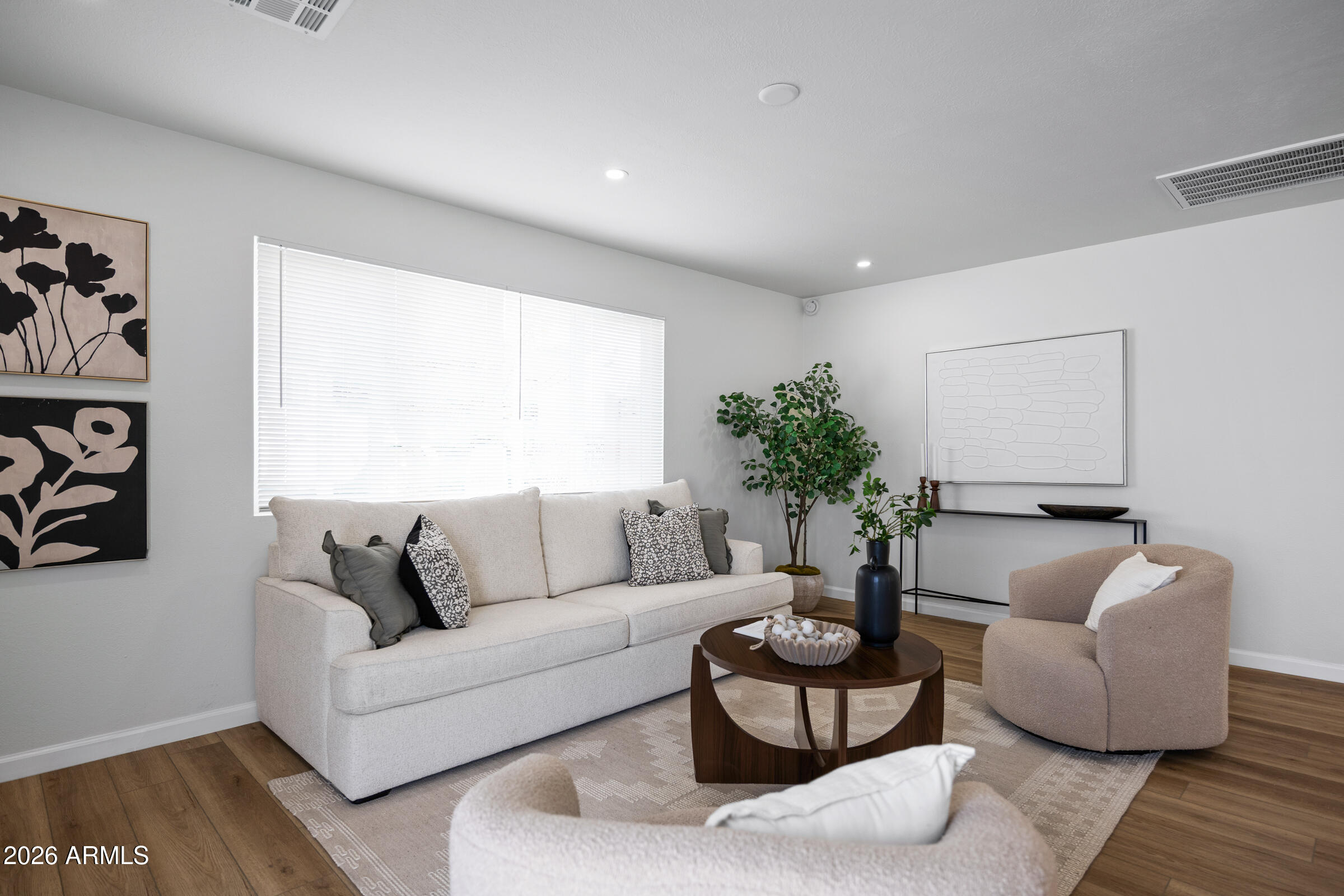 1237 East Ruth Avenue Phoenix, AZ 85020 - Photo 8 of 38 a living room with furniture and a large window