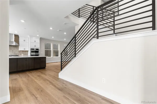a view of kitchen with sink and wooden floor