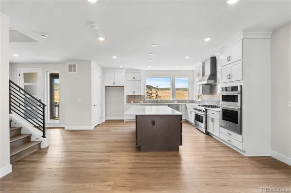 a view of kitchen with wooden floor