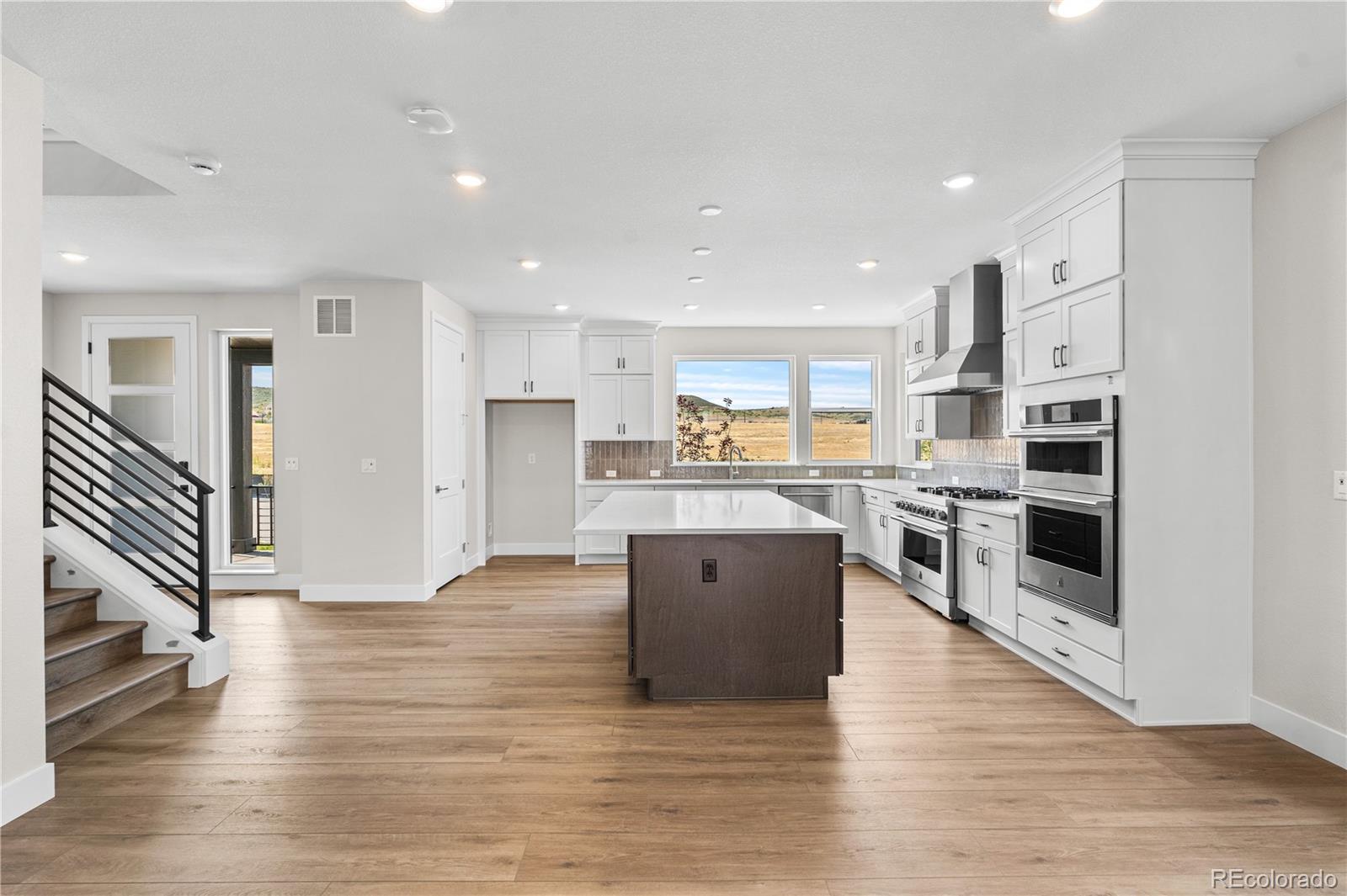 11208 Vibrato Lane Lone Tree, CO 80134 - Photo 16 of 40 a view of kitchen with wooden floor