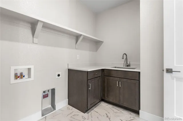 a kitchen with cabinets a sink and dishwasher