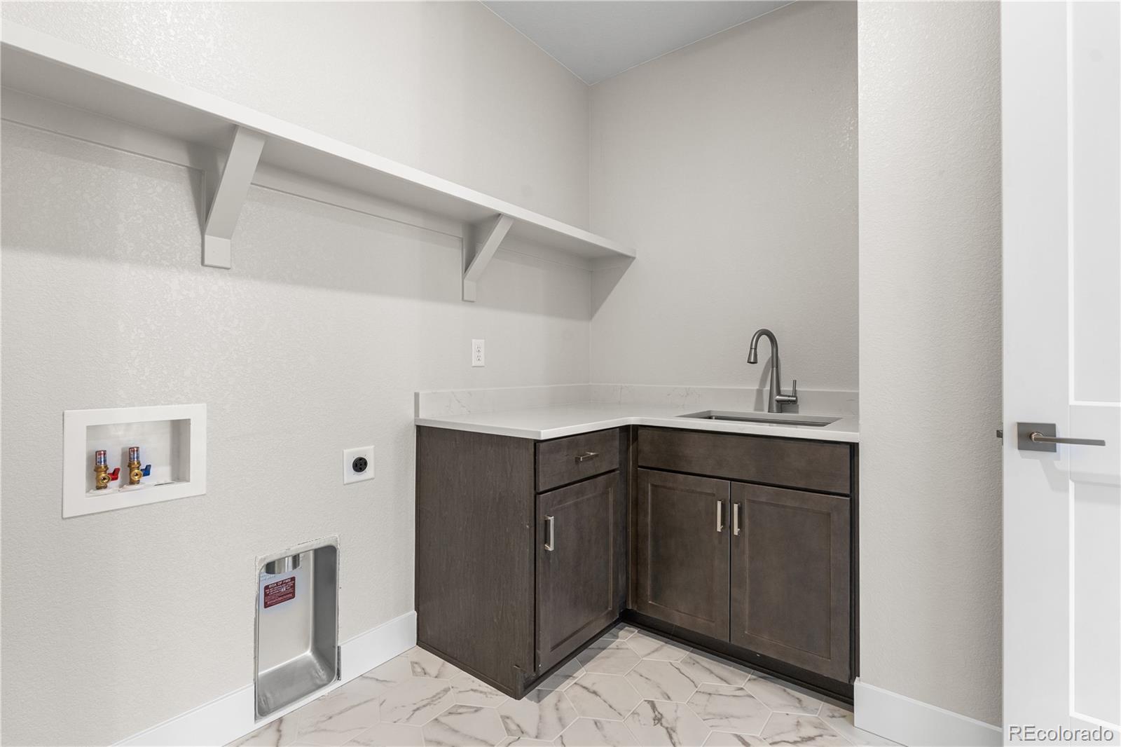 11208 Vibrato Lane Lone Tree, CO 80134 - Photo 19 of 40 a kitchen with cabinets a sink and dishwasher