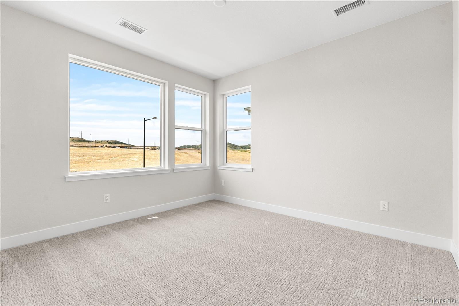11208 Vibrato Lane Lone Tree, CO 80134 - Photo 27 of 40 a view of an empty room with a window