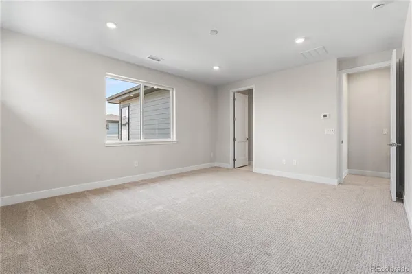 a view of an empty room with a window