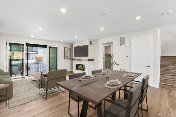 a view of a dining room with furniture window and wooden floor