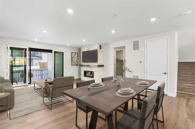 a view of a dining room with furniture window and wooden floor