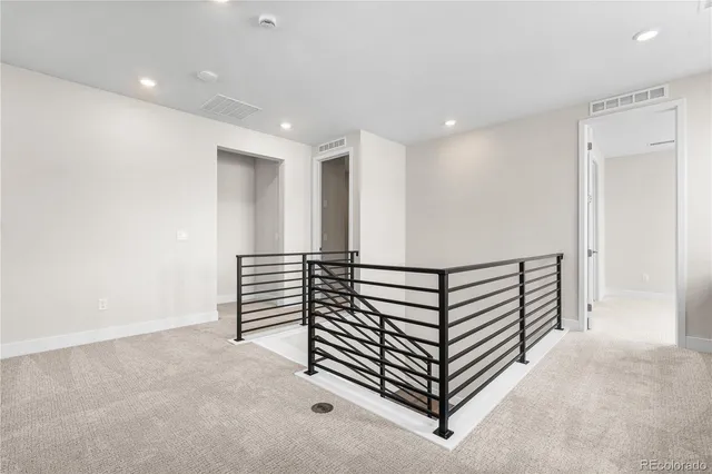 a view of a hallway with stairs