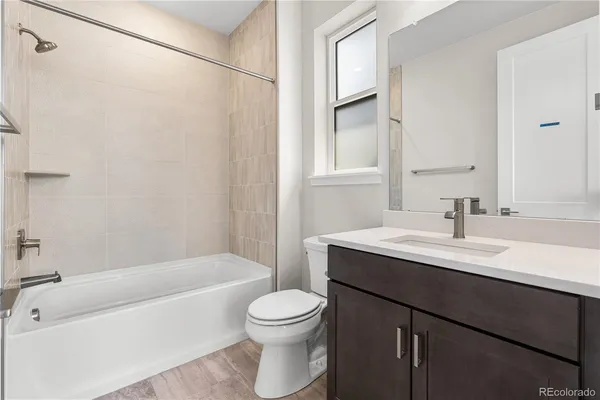 a bathroom with a sink a toilet and a bathtub