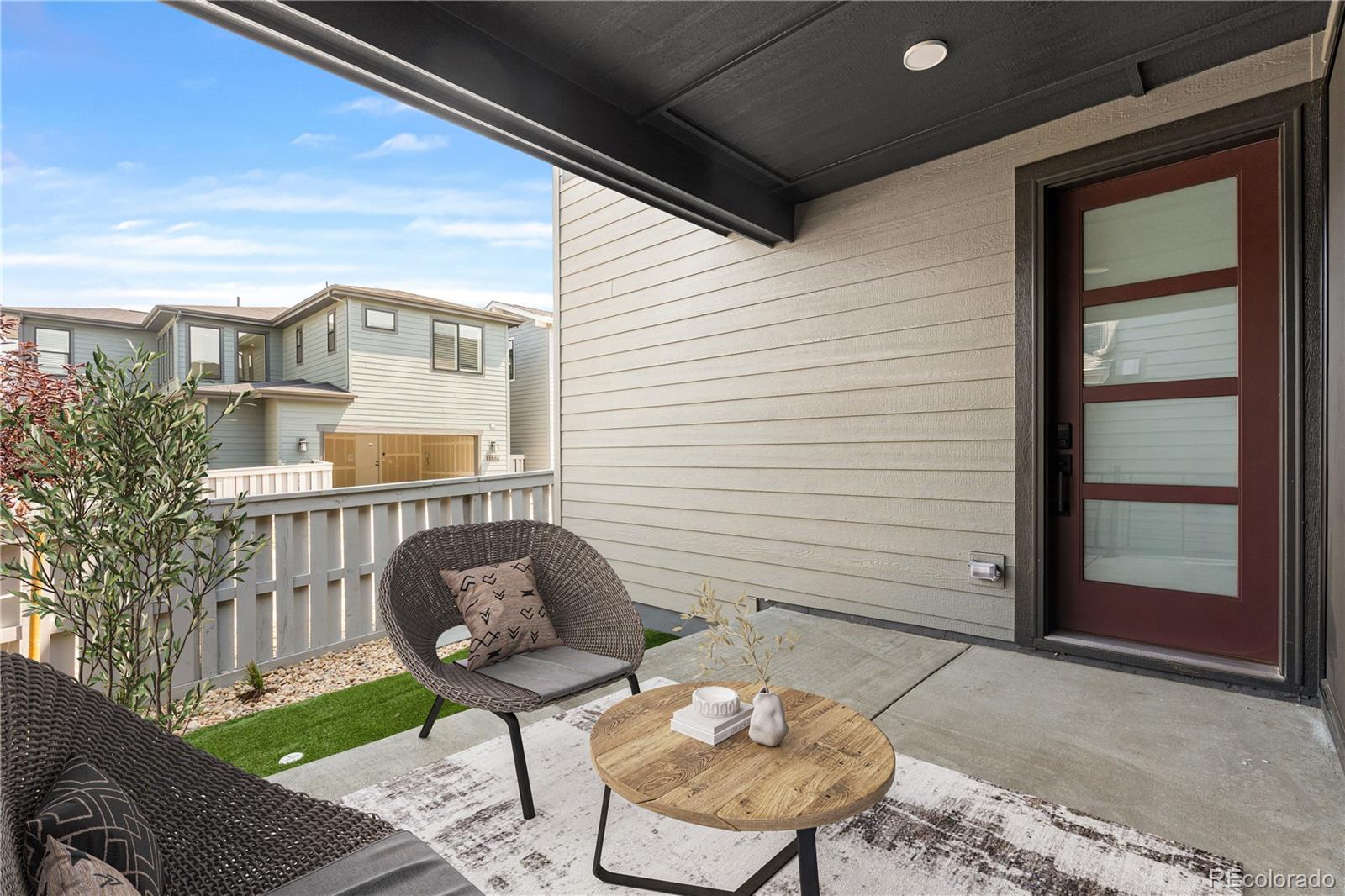 11208 Vibrato Lane Lone Tree, CO 80134 - Photo 39 of 40 a front view of a house with outdoor seating