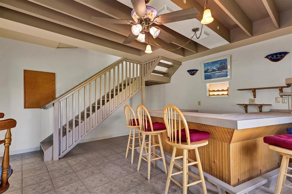 709 Armada Road South Venice, FL 34285 - Photo 20 of 52 Bar with stairs to upstairs bedroom