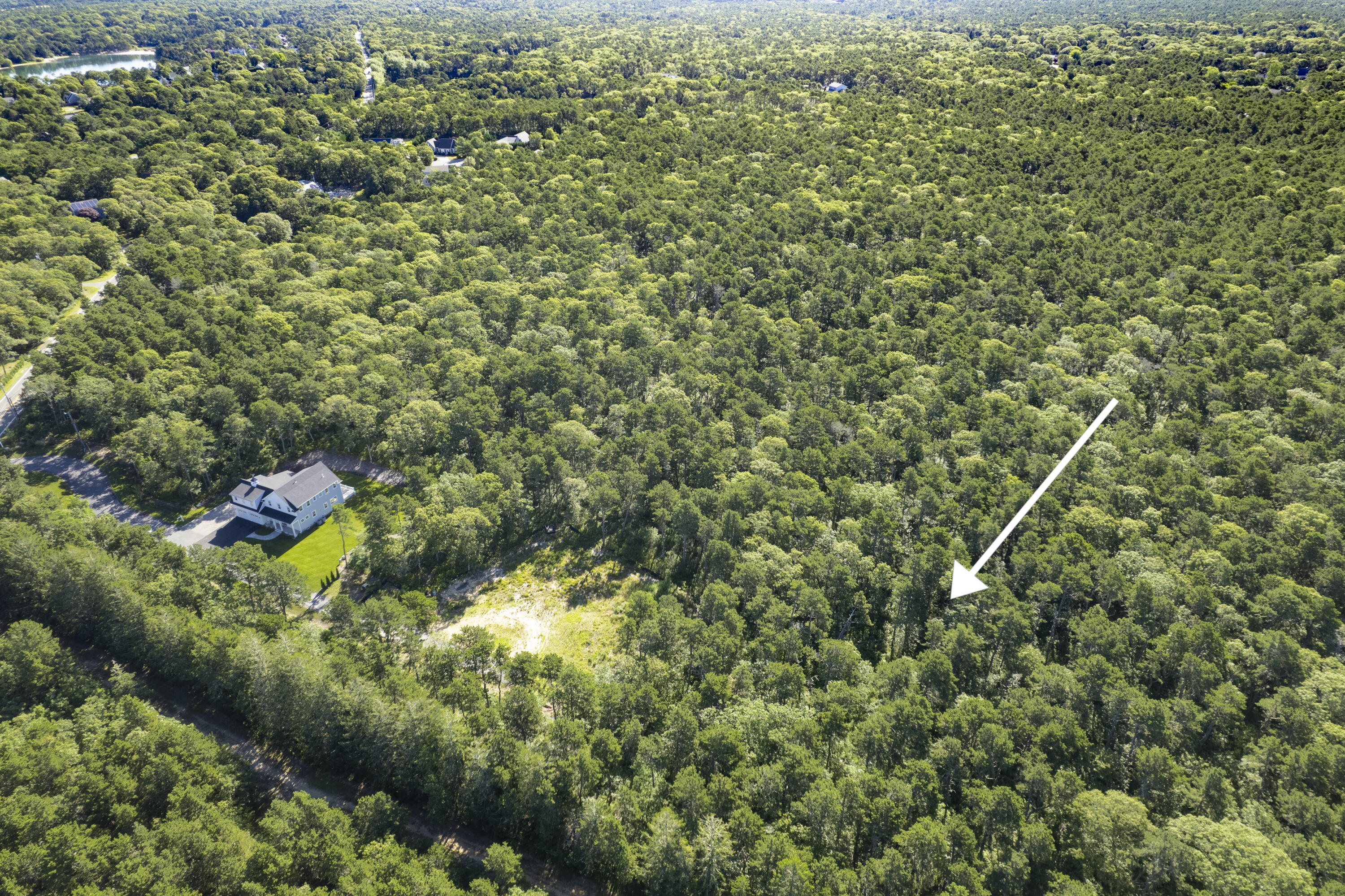 0 South Orleans Road Harwich, MA 02645 - Photo 2 of 3 a view of a house with a lush green forest