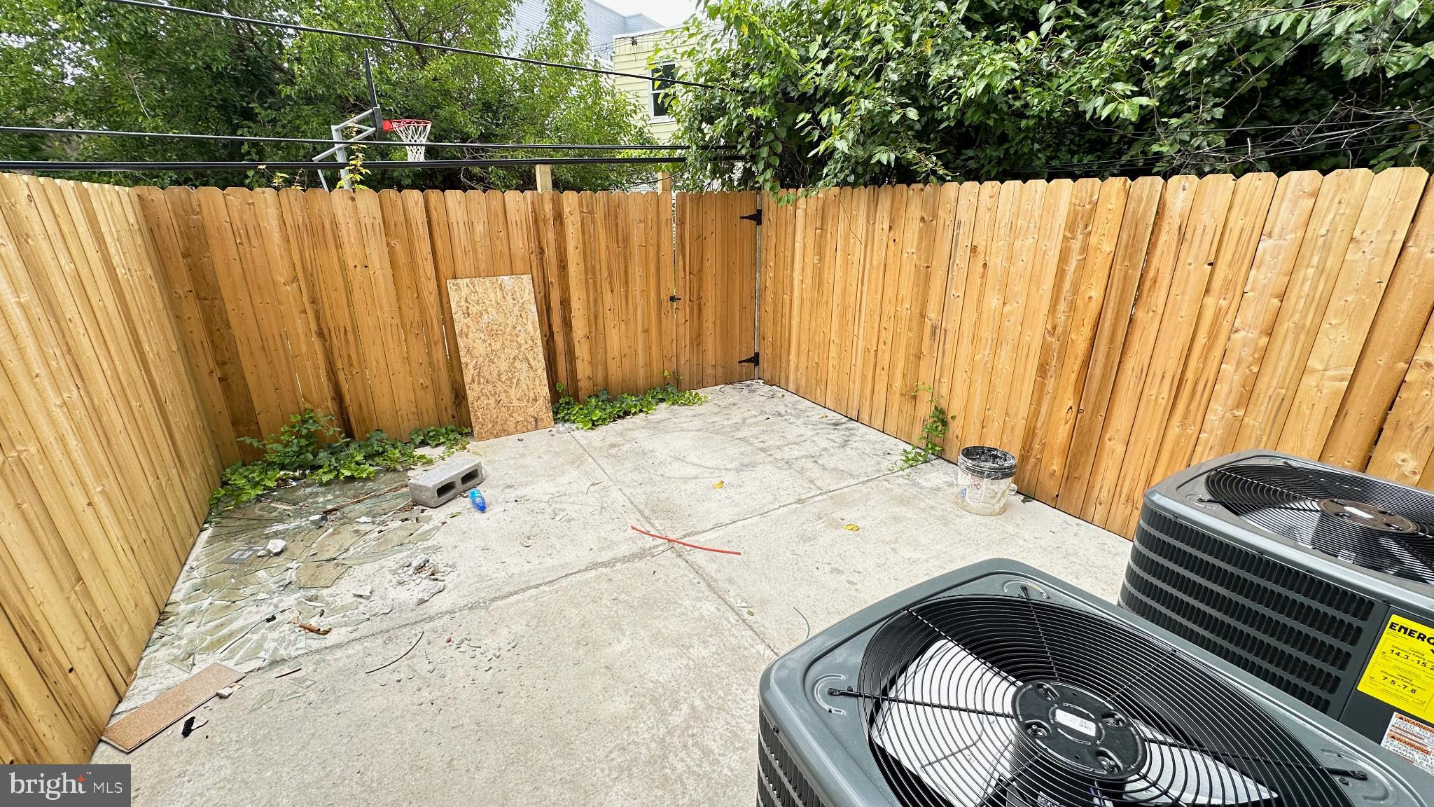 3924 North 13th Street, Unit A Philadelphia, PA 19140 - Photo 3 of 18 a view of a backyard with wooden fence