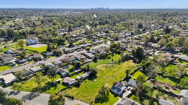an aerial view of residential houses with outdoor space