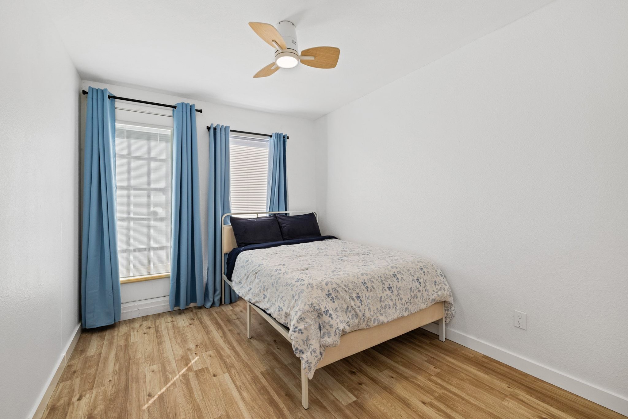 1010 West Rundberg Lane, Unit 30 Austin, TX 78758 - Photo 12 of 30 a bedroom with a bed and a window