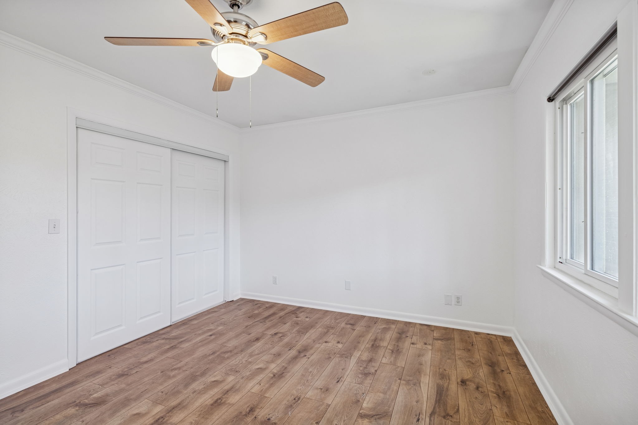 21 Vaughns Gap Road, Unit 14 Nashville, TN 37205 - Photo 17 of 26 an empty room with a window and a ceiling fan