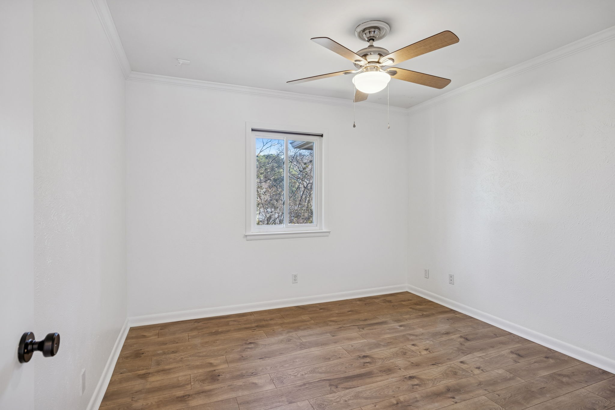21 Vaughns Gap Road, Unit 14 Nashville, TN 37205 - Photo 19 of 26 an empty room with a window and a ceiling fan