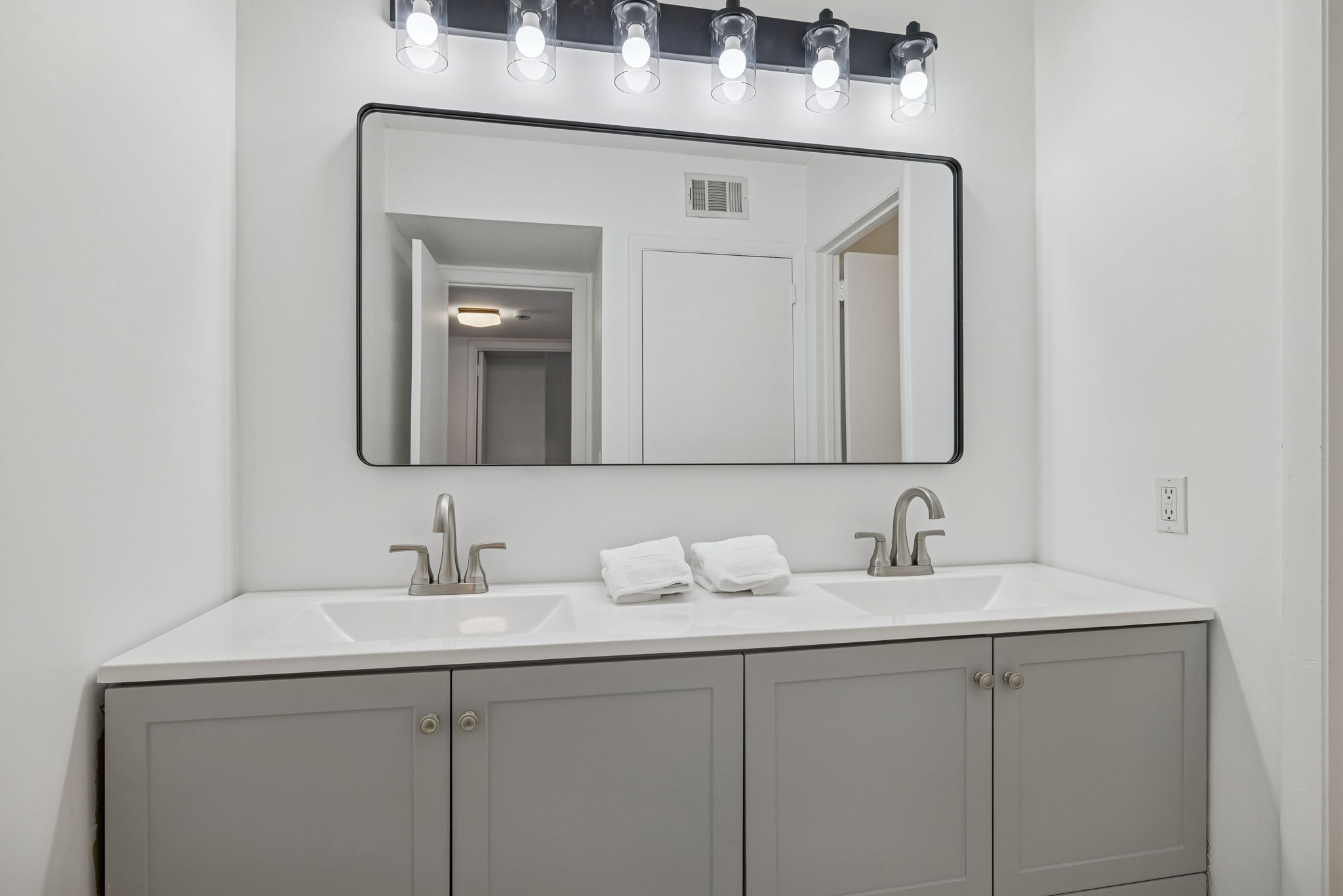 21 Vaughns Gap Road, Unit 14 Nashville, TN 37205 - Photo 21 of 26 a bathroom with a double vanity sink and a mirror