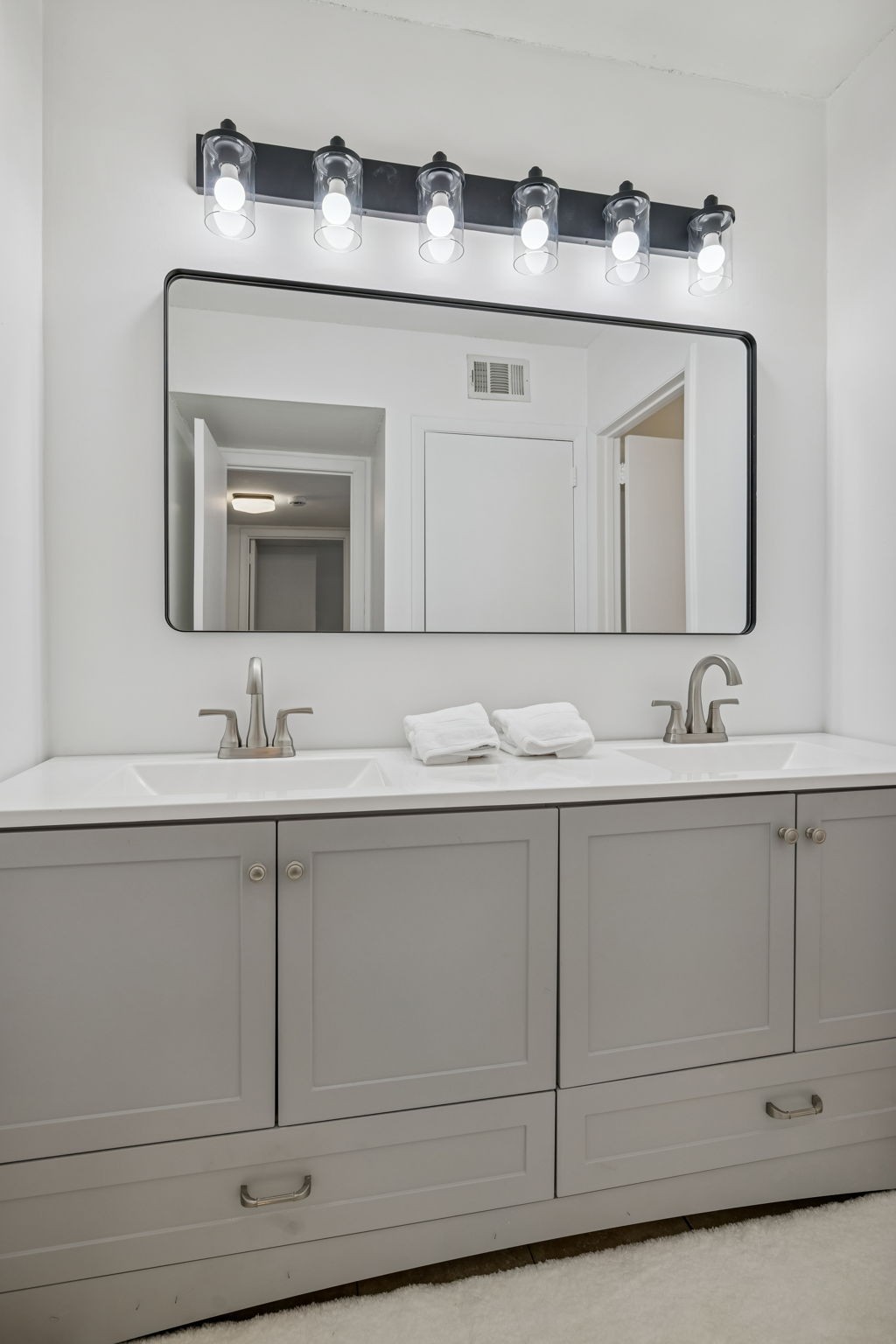 21 Vaughns Gap Road, Unit 14 Nashville, TN 37205 - Photo 22 of 26 a bathroom with sink mirror and cabinets