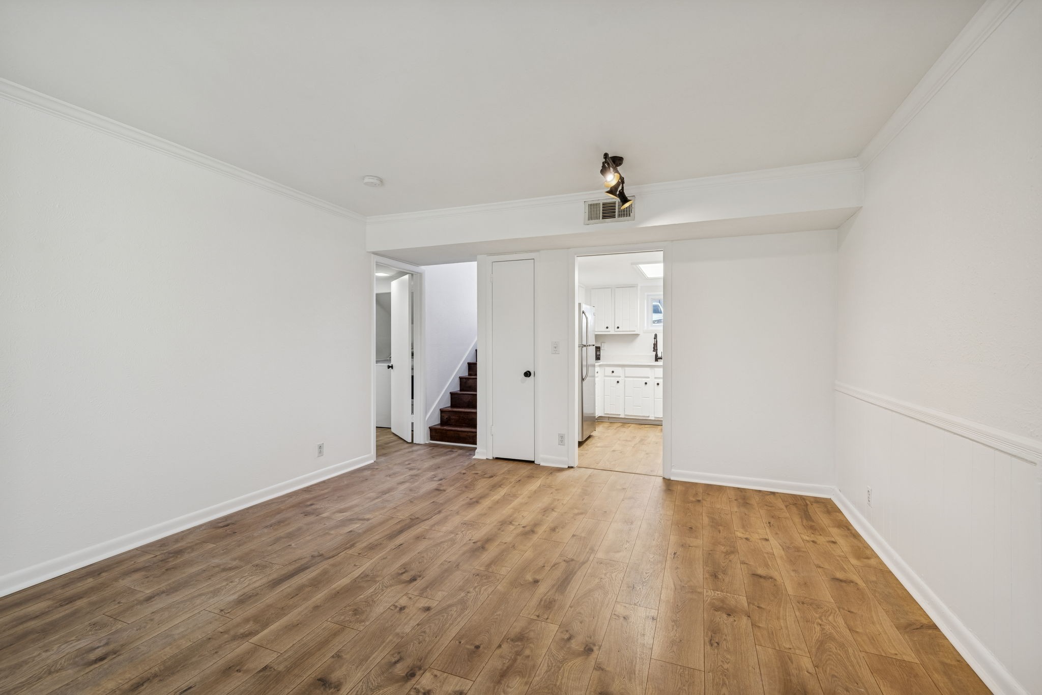 21 Vaughns Gap Road, Unit 14 Nashville, TN 37205 - Photo 4 of 26 wooden floor in an empty room with a window