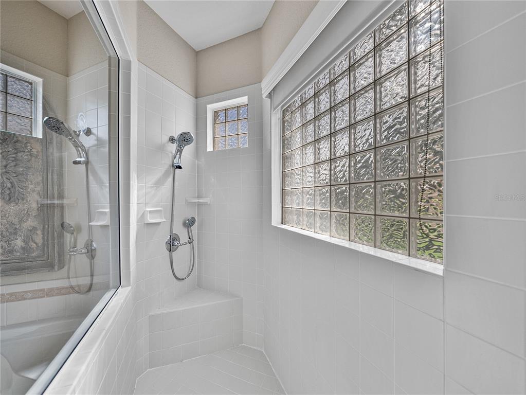 4004 Sable Loop Drive Lake Wales, FL 33859 - Photo 34 of 94 a en suite bathroom with a shower and a bathtub