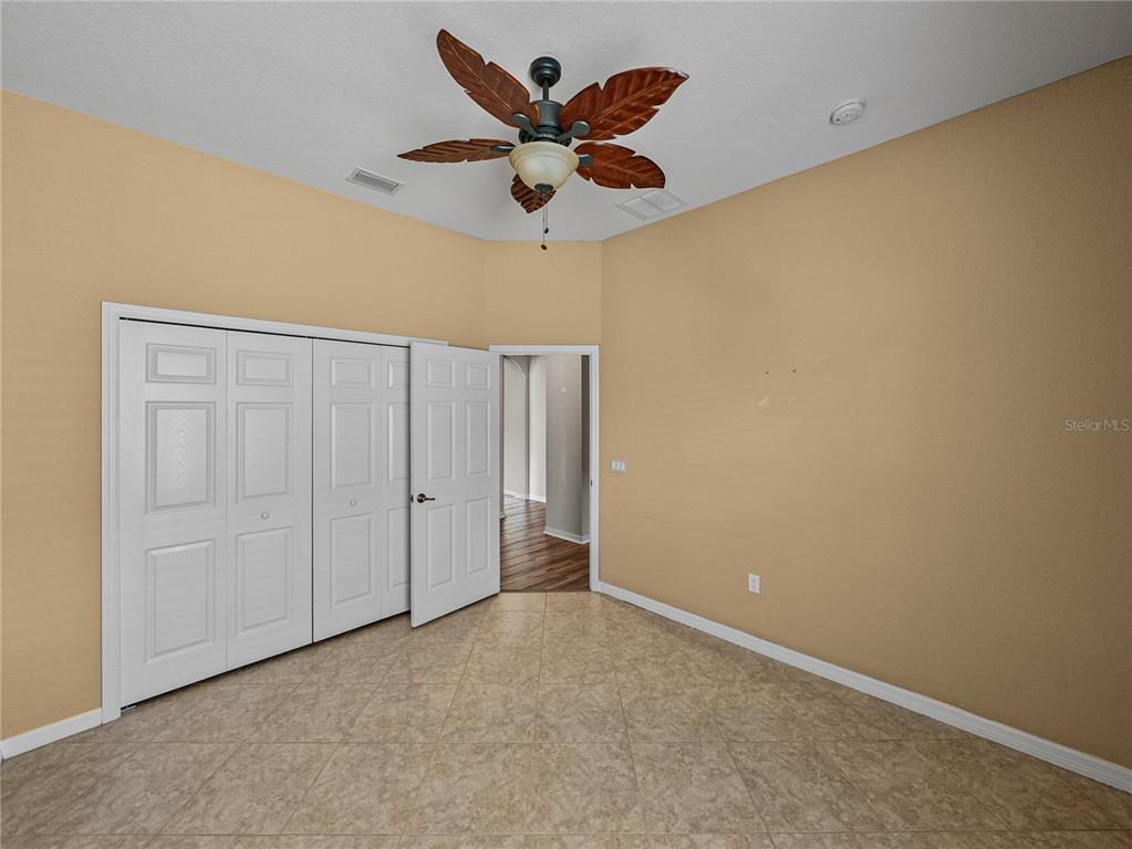 4004 Sable Loop Drive Lake Wales, FL 33859 - Photo 41 of 94 an empty room with closet and ceiling fan