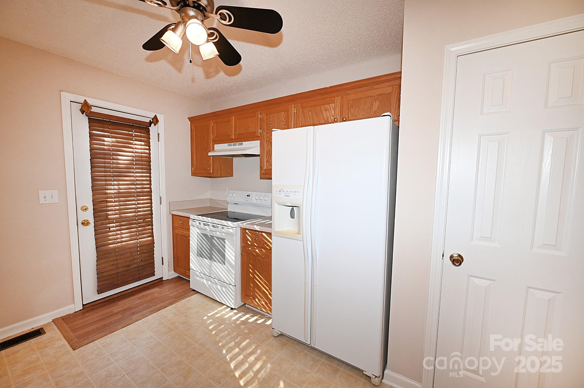 621 23rd Street Northwest Hickory, NC 28601 - Photo 13 of 35 a view of a kitchen with a sink dishwasher and a refrigerator