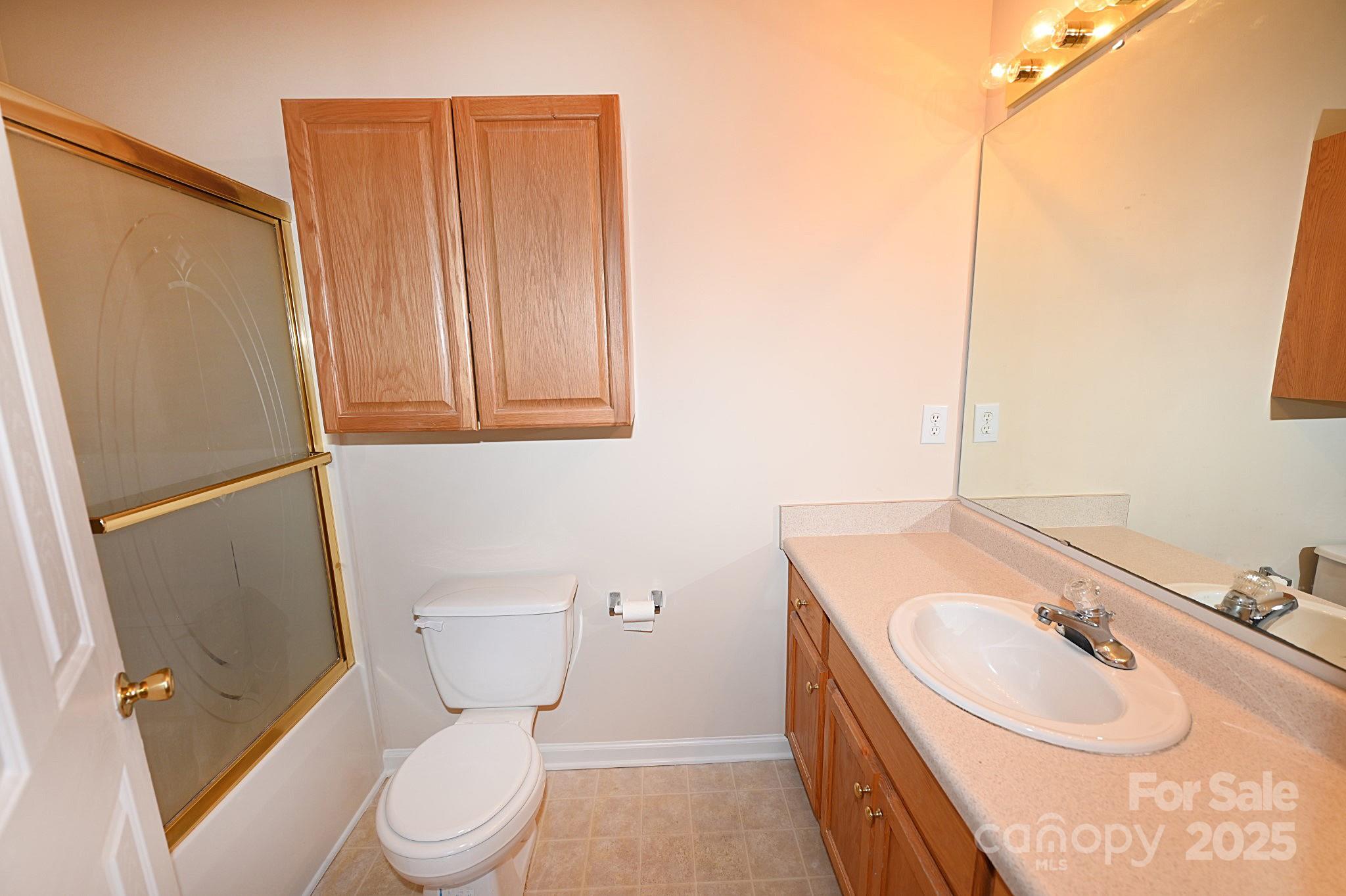 621 23rd Street Northwest Hickory, NC 28601 - Photo 26 of 35 a bathroom with a granite countertop sink toilet and shower