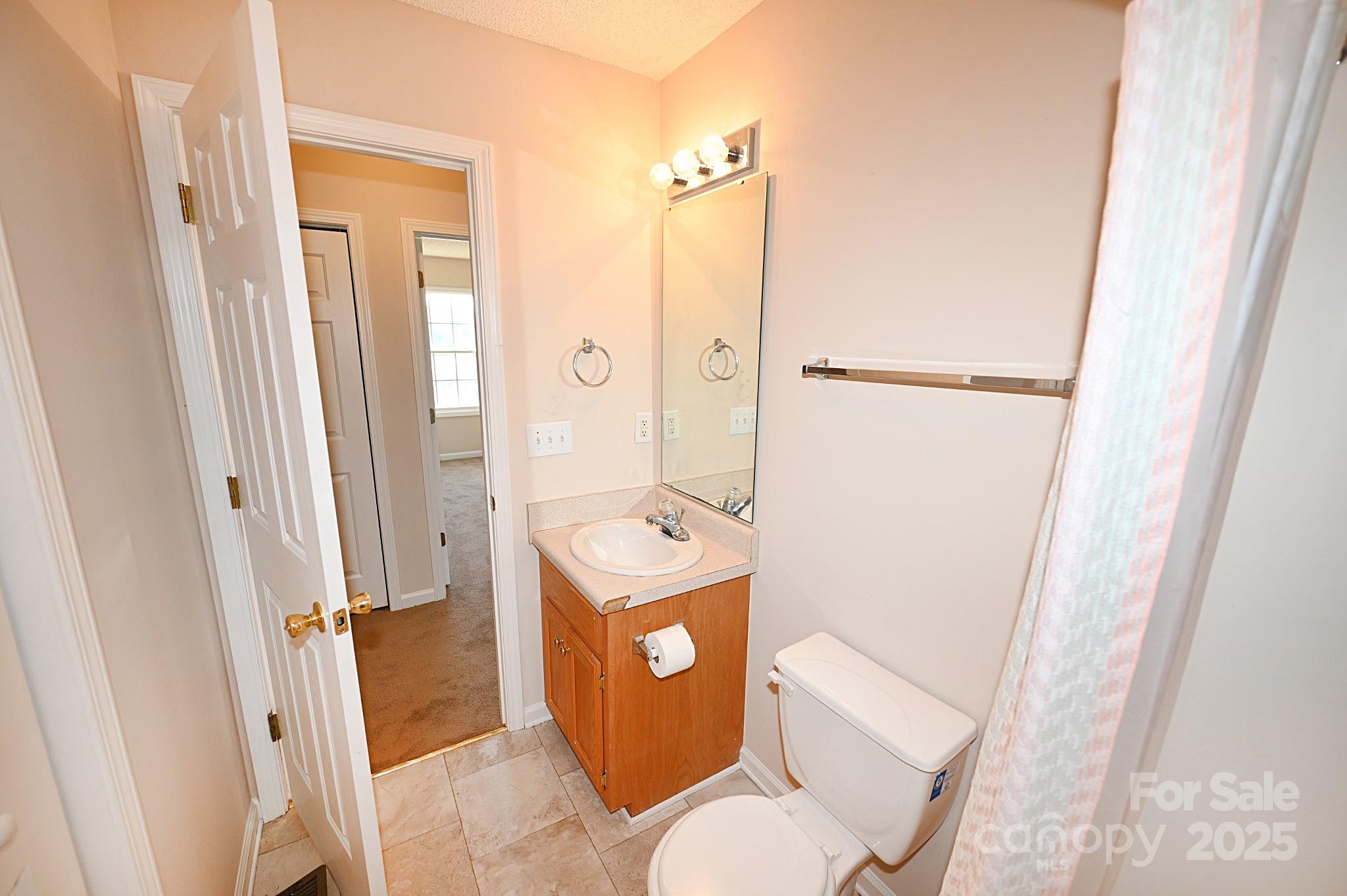621 23rd Street Northwest Hickory, NC 28601 - Photo 28 of 35 a bathroom with a toilet a sink and a shower