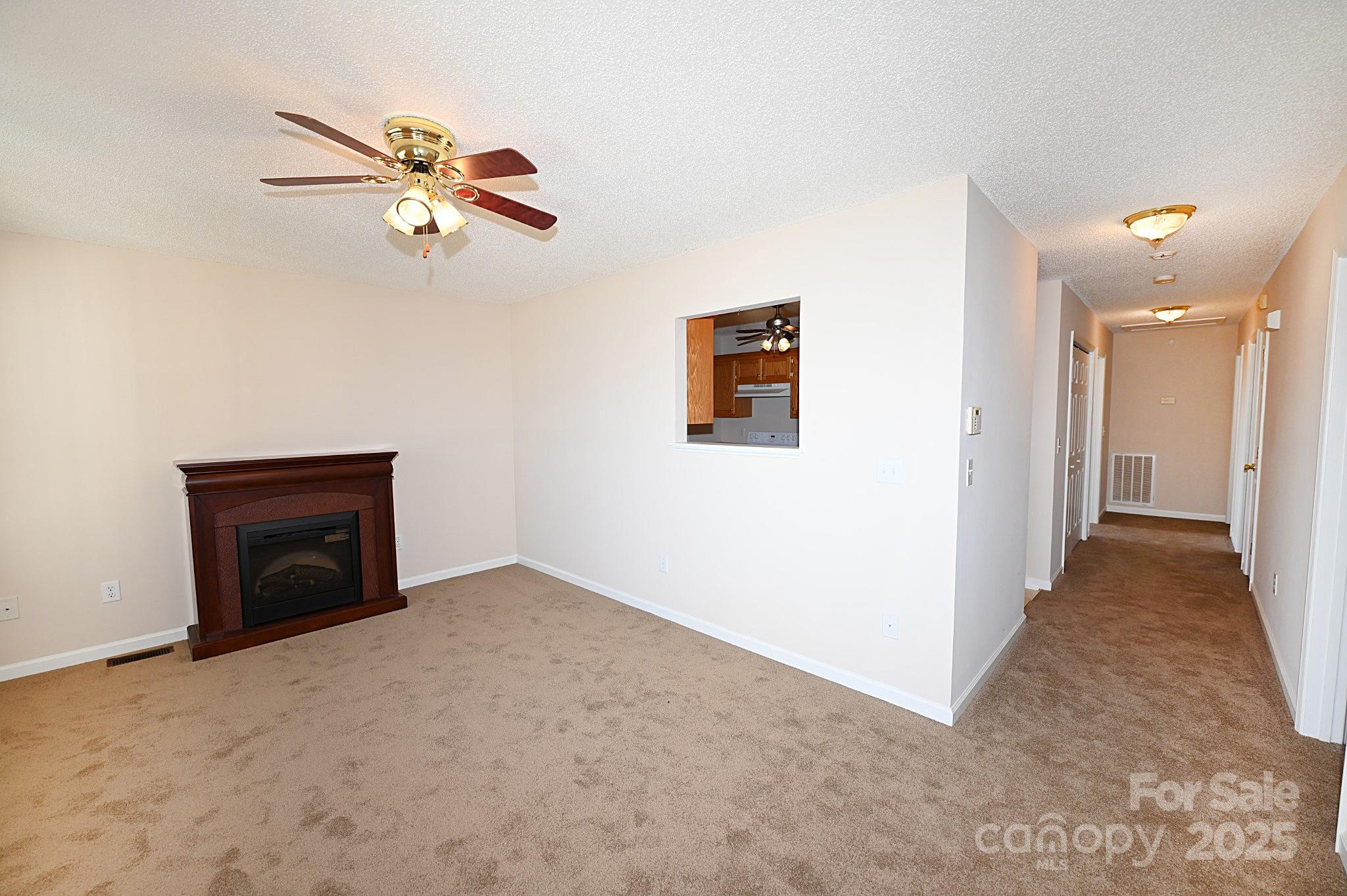 621 23rd Street Northwest Hickory, NC 28601 - Photo 6 of 35 a view of a livingroom with a ceiling fan and chandelier fan